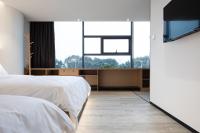 Changsha Desti Youth Park Hostel Wuyi Squareにあるベッド