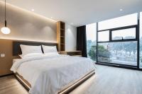 Changsha Desti Youth Park Hostel Wuyi Squareにあるベッド