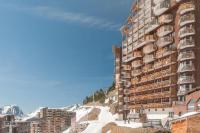a large apartment building with snow on a mountain at Résidence Antarès - Avoriaz in Avoriaz