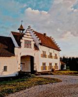 a large white building with a red roof at Ferme Delgueule in Tournai