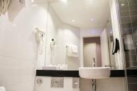 a white bathroom with a sink and a mirror at Holiday Inn Express Amiens, an IHG Hotel in Amiens