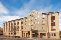 a building with a dutton hotel sign on it at Country Inn &amp; Suites by Radisson, Sioux Falls, SD in Sioux Falls