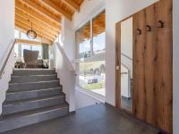 a staircase in a house with a sliding door at Grebenzen Lodge Prinz in Sankt Lambrecht