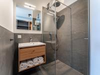 a bathroom with a shower and a sink at Grebenzen Lodge Prinz in Sankt Lambrecht