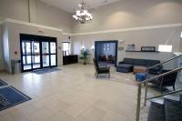 Ein Bett oder Betten in einem Zimmer der Unterkunft Country Inn &amp; Suites by Radisson, Council Bluffs, IA