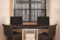 Country Inn & Suites by Radisson, Elk Grove Village-Itascaにあるテレビまたはエンターテインメントセンター