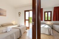 Posteľ alebo postele v izbe v ubytovaní Apartamentos Casa del Sol
