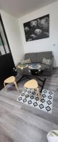 a living room with two chairs and a couch at LOGEMENT CLICHY in Clichy