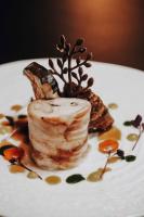 Un plato blanco con un trozo de comida encima. en Relais di campagna la polledrara, en Paliano