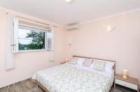 Posteľ alebo postele v izbe v ubytovaní Apartments Lena & Lara