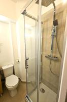 a bathroom with a toilet and a shower at Comme une suite près du métro in Clichy