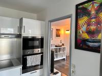 Kuchnia lub aneks kuchenny w obiekcie Cosy Duplex avec Parking à Paris 19 by immo kit bnb