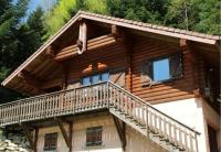 a log cabin with a balcony and stairs on it at LE GRAND CERF Chalet en rondins avec SPA Jacuzzi in La Bresse