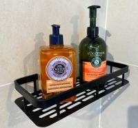 two bottles of soap sitting on a shelf at Mas CamPau in Fontvieille