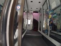 a hallway in a subway train with a stair case at Residence Chatillon in Paris