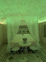 A bed or beds in a room at B&B Lo Scrigno del Salento