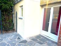 an entrance to a house with a glass door at La Domus Lemaitre 1, plain-pied, Wifi , TV, parking, jardin 