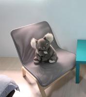 a stuffed elephant sitting on top of a chair at 萩閣民宿Sara&#39;s House走路可到夜市近市區好停車 in Hualien City