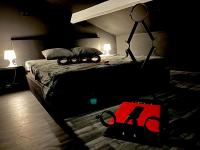 a bedroom with a bed with a toy train on it at Amour d&#39;une Nuit, LoveRoom in Sarcelles