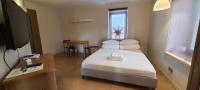 Posteľ alebo postele v izbe v ubytovaní Apartamenty na Poludniowym Stoku