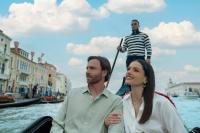 a man and a woman on a gondola on the water at Baglioni Hotel Luna - The Leading Hotels of the World in Venice