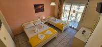 Posteľ alebo postele v izbe v ubytovaní Chariclia Hotel