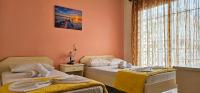 Posteľ alebo postele v izbe v ubytovaní Chariclia Hotel