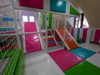 a play room with colorful play equipment in a room at Hotel Pepa in Divčibare