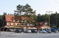 a group of cars parked in front of a building at Hotel Pepa in Divčibare