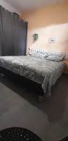 a large bed in a room with at Chambre diamants in Saint-Pierre