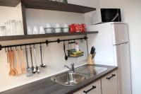 Kuchyňa alebo kuchynka v ubytovaní Apartment Apolon planinski