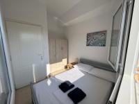 Posteľ alebo postele v izbe v ubytovaní PebBle Apartments