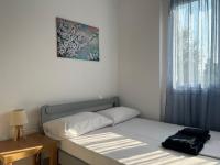Posteľ alebo postele v izbe v ubytovaní PebBle Apartments