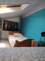 Łóżko lub łóżka w pokoju w obiekcie Villa Patio Capbreton