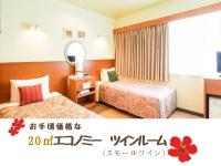 ホテルサンパレス球陽館にあるベッド