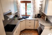 a small kitchen with a sink and a window at Appartement Mountainrelax Gastein in Dorfgastein