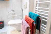a bathroom with towels on a towel rack next to a toilet at Appartement Mountainrelax Gastein in Dorfgastein
