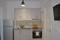 Kuchyňa alebo kuchynka v ubytovaní Oniropetra Apartments Mykonos