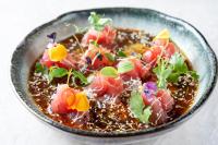 a bowl of food with vegetables in it at La Mansion Vi Vadi Hotel in Munich