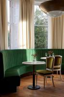 a green couch with two chairs and a table at Marine North Berwick in North Berwick