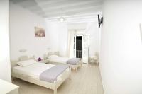 A bed or beds in a room at Dimitra Pension