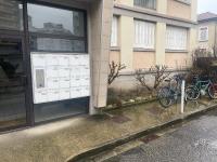 two bikes are parked outside of a building at T4 spacieux tout confort &#47; parking gratuit in Grenoble
