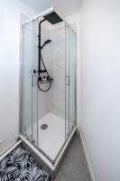 a shower with a glass enclosure in a bathroom at Le CosyNaï - 20min to Paris in Sannois