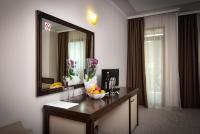 A television and/or entertainment centre at Rhodopi Home Hotel Chepelare - Half Board & All inclusive