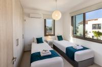 Postel nebo postele na pokoji v ubytování Accomoteleia Blue Villa