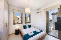 Postel nebo postele na pokoji v ubytování Accomoteleia Blue Villa
