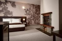 A bed or beds in a room at Rhodopi Home Hotel Chepelare - Half Board & All inclusive
