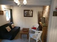 a living room with a couch and chairs and a table at Lovely cottage in Honfleur center in Honfleur