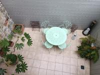an overhead view of a patio with a table and chairs at Lovely cottage in Honfleur center in Honfleur