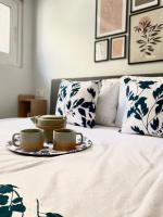 A bed or beds in a room at Ivy, 4 minutes from the sea